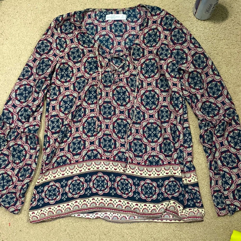 Size XS, ties in the front, thin material, worn 5 times